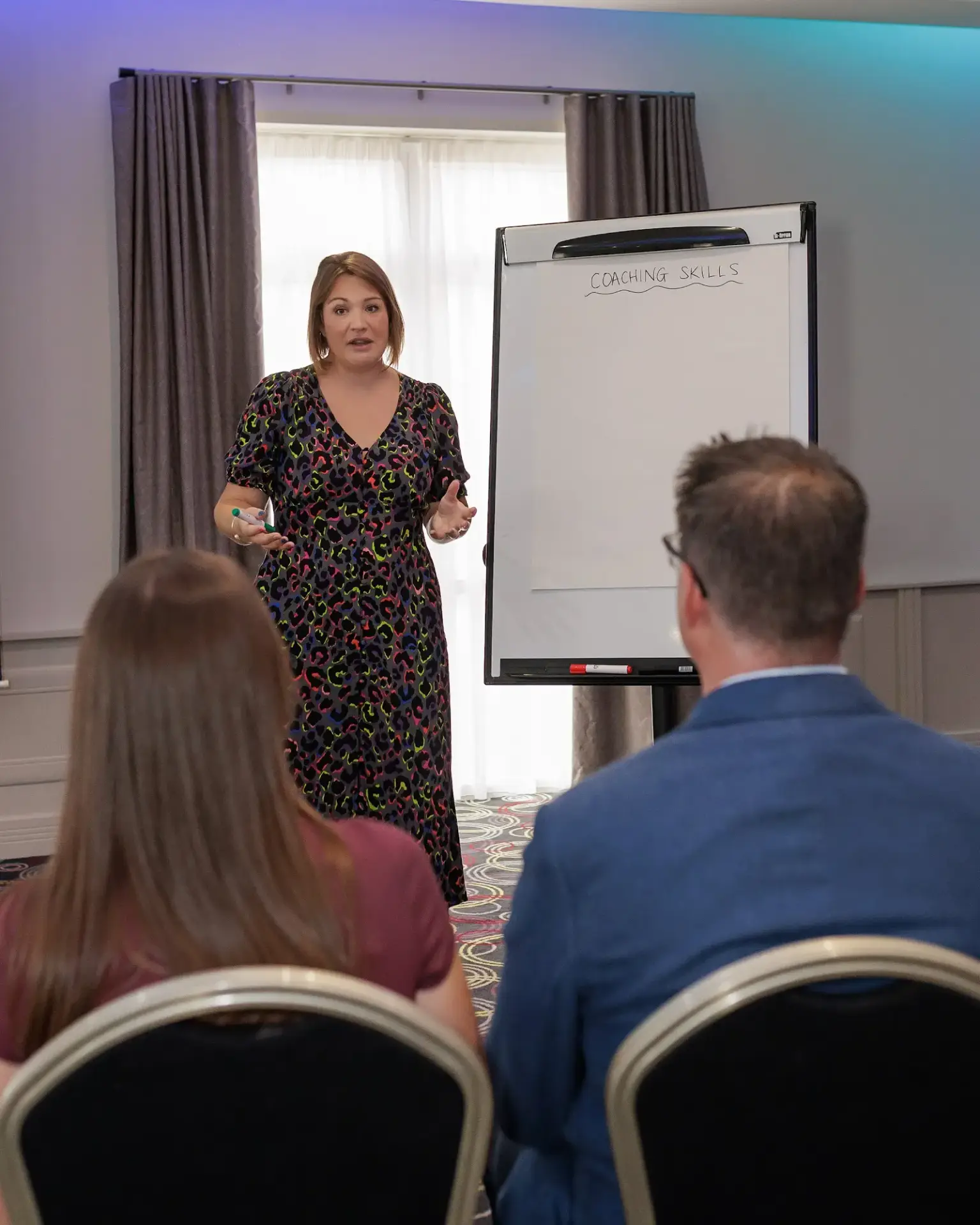 Verity Stainsby leading a workshop beside a flip chart